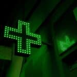green and white x sign